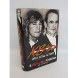 A book titled XS All Areas, the Status Quo autobiography, featuring Francis Rossi and Rick