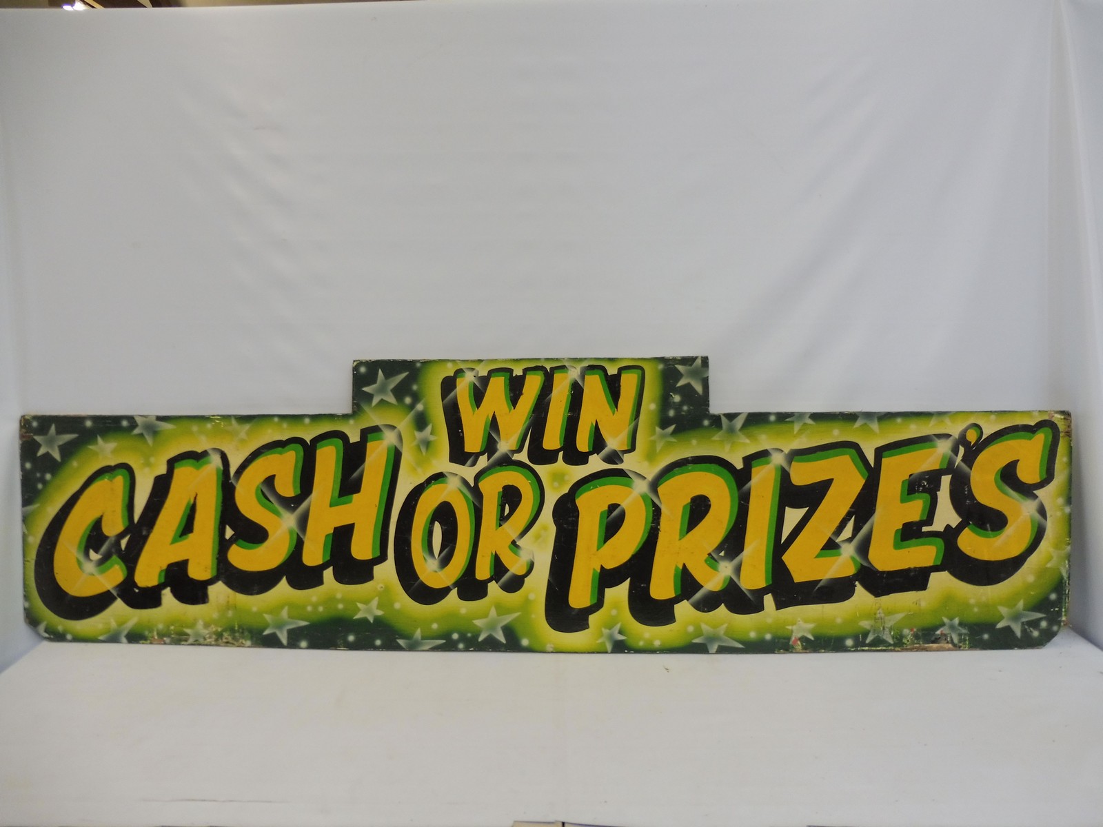 A fairground brightly coloured wooden sign 'Win Cash or Prizes', 71 1/2 x 20".