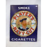 A Player's Navy Cut Cigarettes double sided enamel sign with hanging flange, pictorial to one side