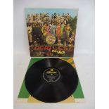 A Beatles Sgt. Peppers Lonely Hearts Club Band LP, first pressing, Mono, made and printed in GB,