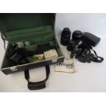 A Minolta camera, two large and good quality lenses etc.