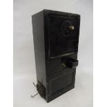 An A & B telephone coin operated box, with key.