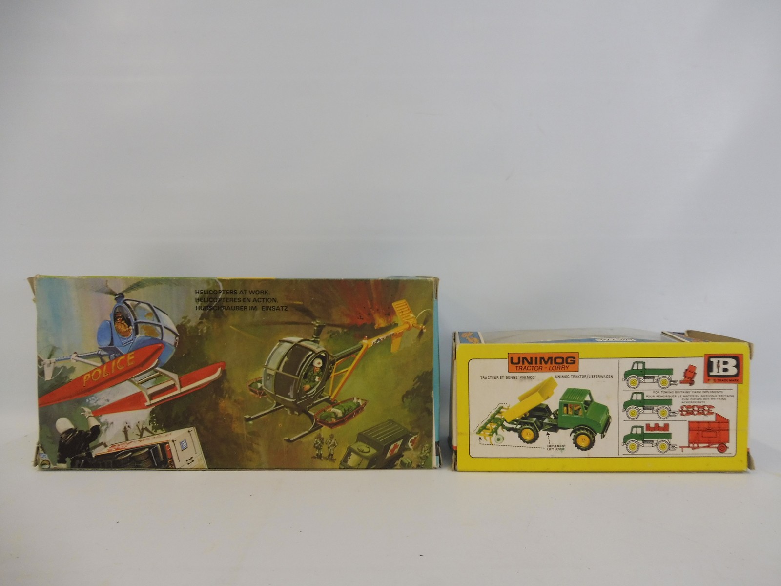 Two Britains circa 1970s models, a Hughes 300c Helicopter , and the Unimog tractor. - Image 3 of 3