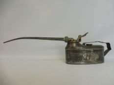 An unusual oiler with long spout and brass mechanism.