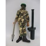 Original Action Man - a circa 1970s figure, wearing camouflage fatigues, with accessories.