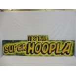 A fairground brightly coloured wooden sign 'It's The Super Hoopla', 72 x 21".