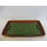 An early wooden football game with metal figures.