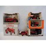 Five Ertl die-cast farm vehicles, various scales to include the Farmall 140 tractor etc.