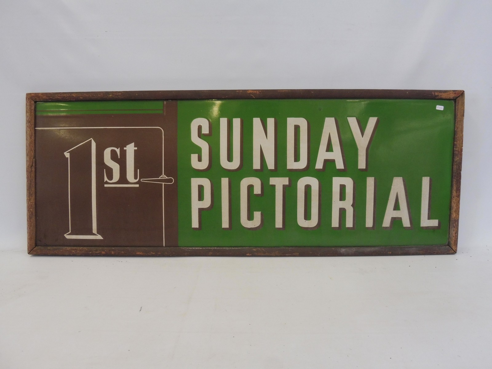 A rare railway enamel sign '1st' Sunday pictorial enamel sign in original frame, 43 x 16 1/4".