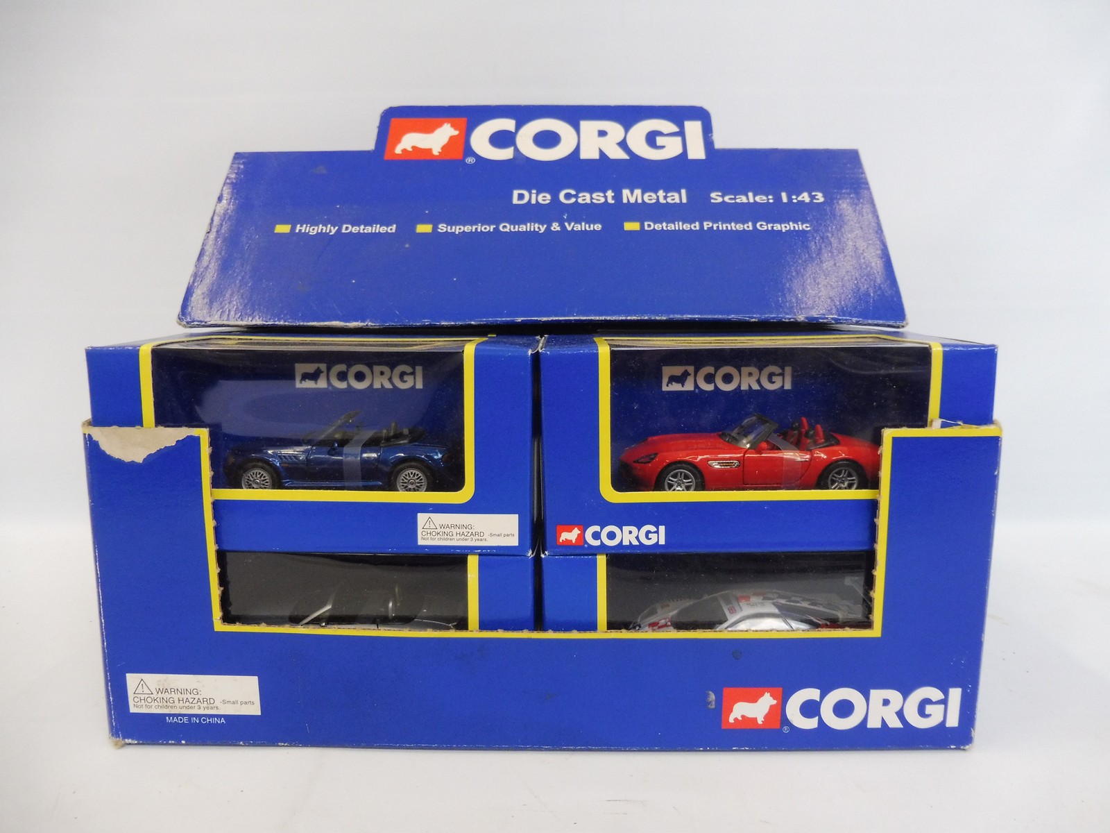 A boxed Corgi 1:43 scale racing car trade pack containing 12 individually boxed models.