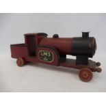 A Lines Bros. LMS wooden locomotive.