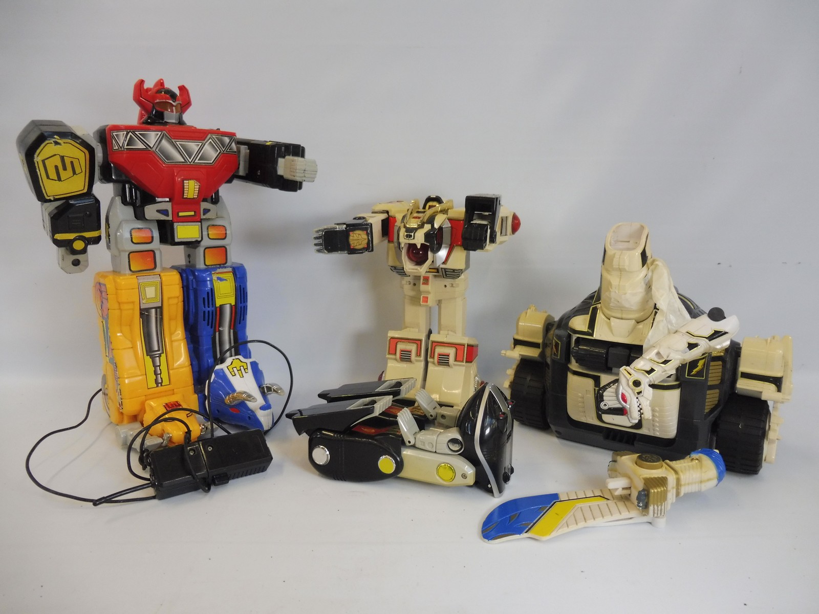 A quantity of large scale Power Rangers and Transformers.