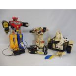 A quantity of large scale Power Rangers and Transformers.