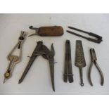 A selection of early tools including a ticket puncher stamped T Newey BR.