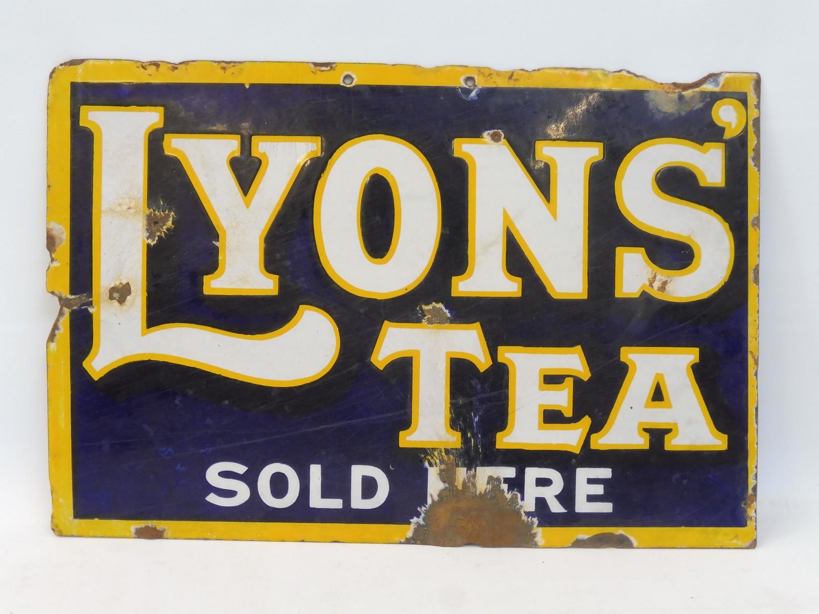 A Lyons' Tea Sold Here double sided enamel sign lacking hanging flange, 18 x 12".