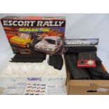 A quantity of Scalextric in a box and an Escort Rally set (cars not present).
