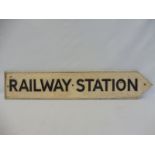 A cast aluminium 'Railway Station' single sided directional arrow sign, 38 x 7".