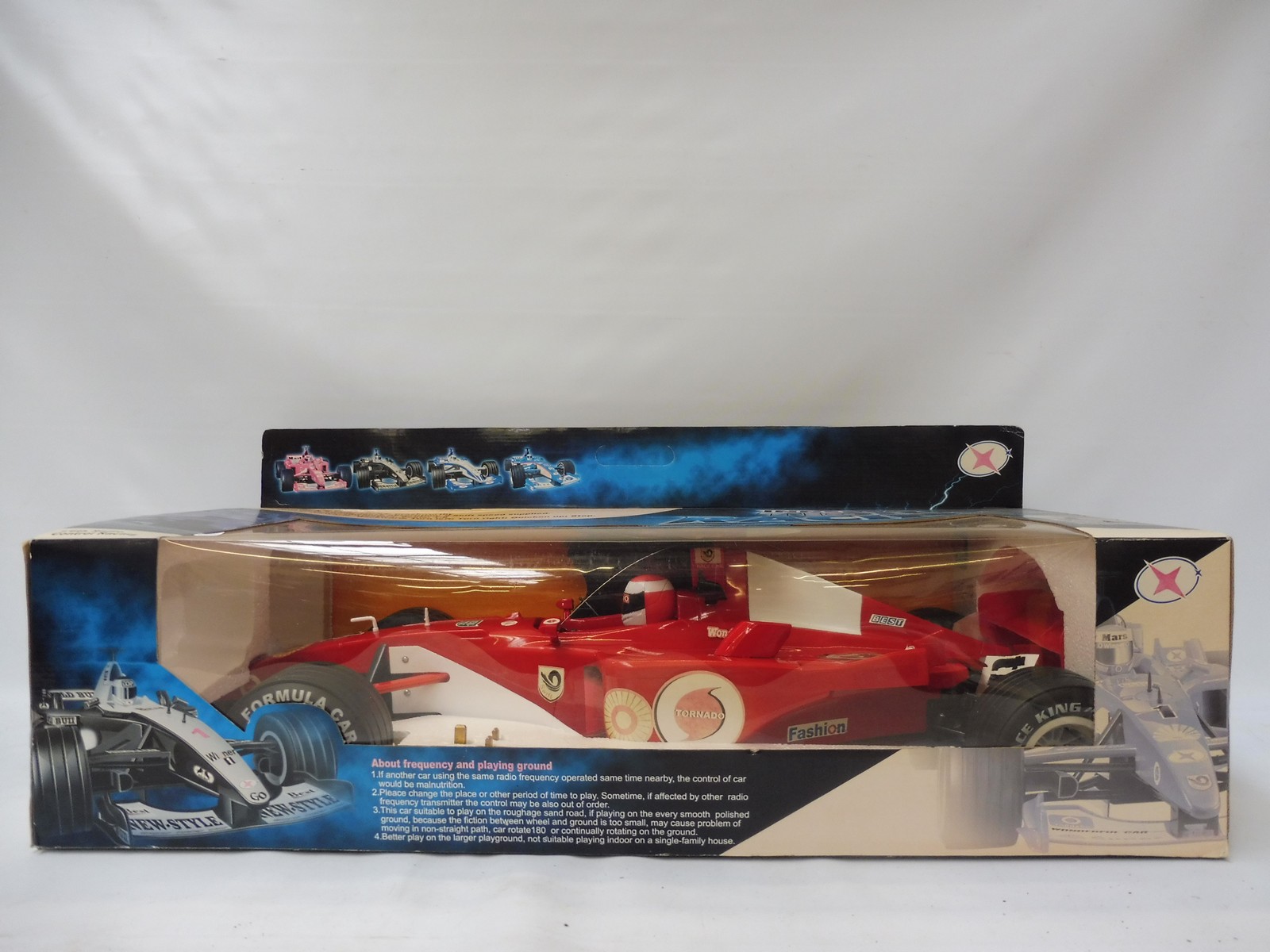 A boxed 1:6th scale remote control formula one racing car, never played with.