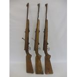Three original fairground rifles from a shooting gallery stall, by repute of German manufacture, for
