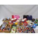 A quantity of Duplo in three boxes, assorted play vehicles etc.