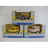 Three boxed Ertl 1:32 scale Land Rovers.