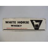 An enamel sign advertising 'White Horse Whisky', by repute sold to the vendor by the White Horse pub