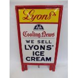 A Lyons Cooling News 'We Sell Lyons' Ice Cream' enamel sign in original stand, the sign in near mint
