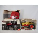 Two boxed Ertl 1:16 scale die-cast agricultural vehicles comprising a 1070 agri-king and the 8465