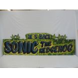 A fairground brightly coloured wooden sign 'It's Back Sonic The Hedgehog', 72 x 22".