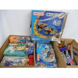 A quantity in three boxes of Meccano, mainly modern and French made.