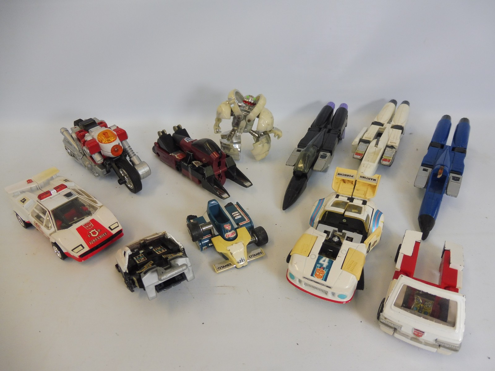 A quantity of original G1 die-cast Made in Japan Transformers.