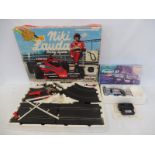 A Polistil Ferrari Racing System, plus a Niki Lauda Champion 175 racing set.