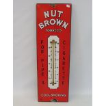 A Nut Brown Tobacco enamel advertising thermometer sign, in good condition, 7 1/2 x 23".