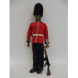 Original Action Man - a circa flock haired figure with a painted face, wearing a grenedier guard