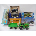 Six boxed agricultural models to include a Case T340 with bull grader etc.