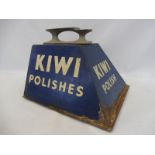 A Kiwi Polish shoe shine stand.