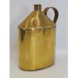 A large polished brass oval can.