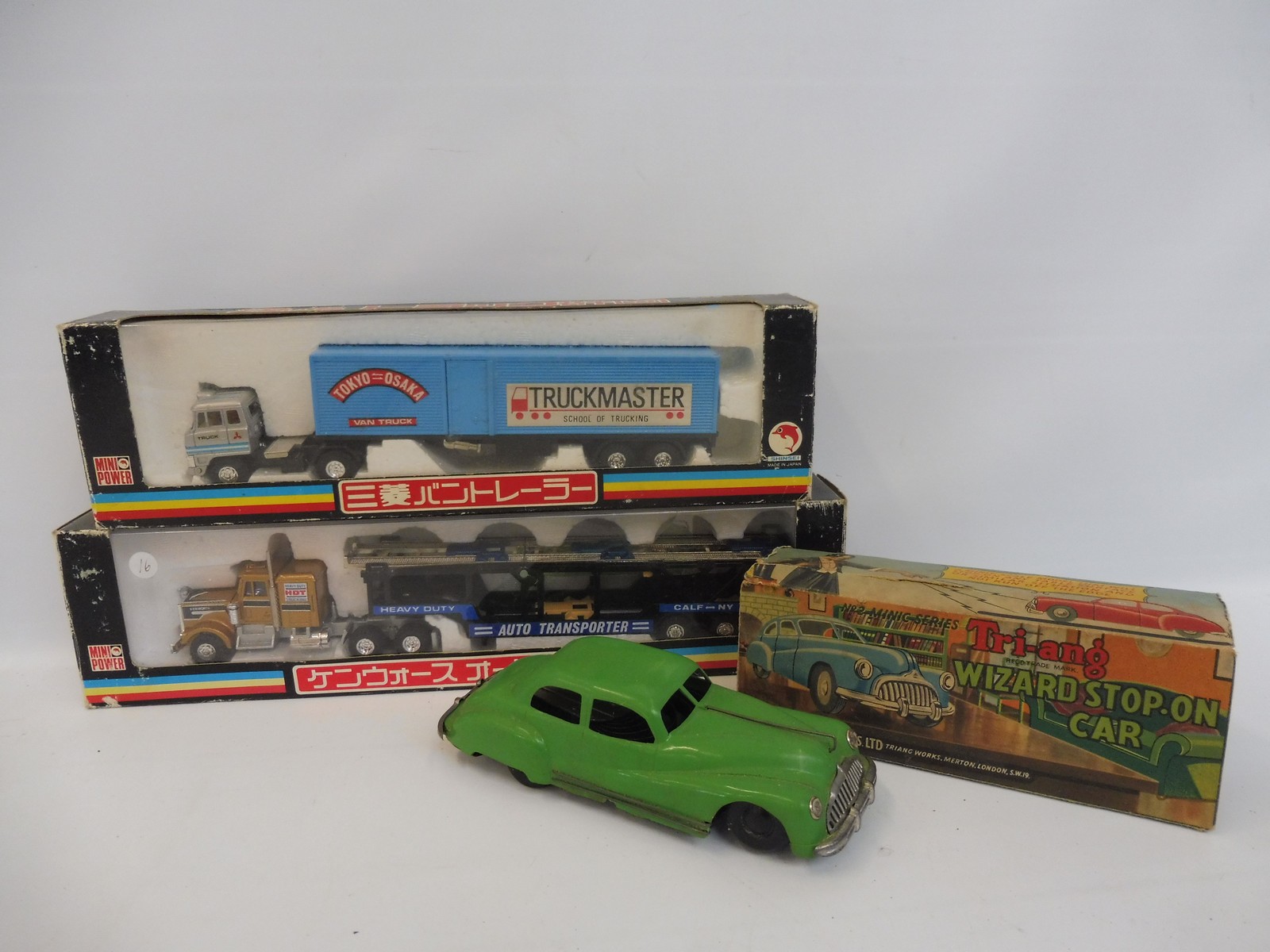 A boxed Tri-ang Wizard tinplate Spot-on-car no.2 series and two boxed super hauliers.