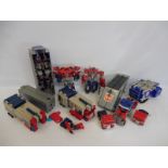 A large quantity of Transformers of different eras, predominantly Optimus Prime.