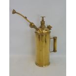 A polished brass sprayer.