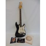 A Made in China Encore electric guitar, signed in large full signature by David Gilmour, this