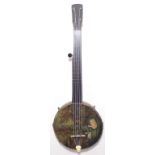 A mid-19th Century five string minstrel banjo c. 1850-60. With a wavy edge pot and six original