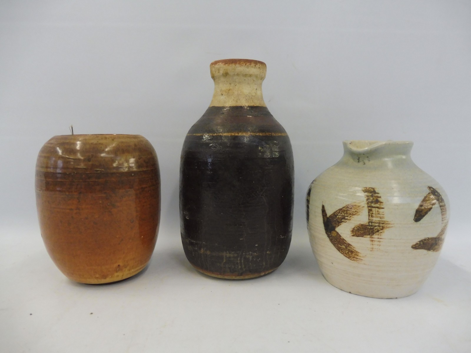 Two studio pottery vases, tallest 8 1/2" high, plus a jug.