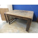 An 18th Century oak drop flap dining table with deep flaps and cantilever action, probably Cornish.