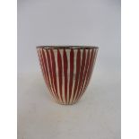 A Chinese beaker of unusual red striped design, impressed mark to base, 2 1/2" high.