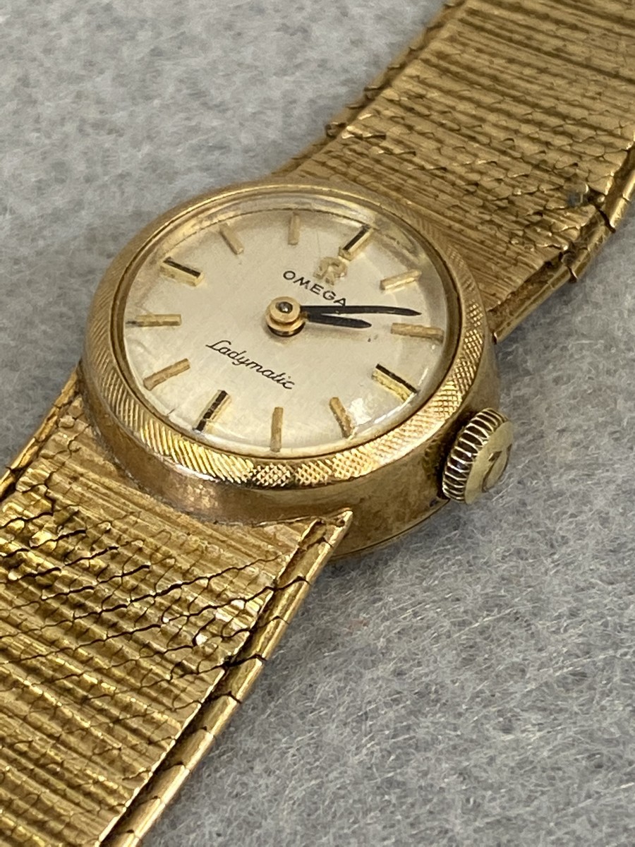 A 9ct gold Omega Ladymatic wristwatch with original strap.