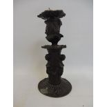 An unusual and well detailed bronze candlestick.