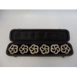 A cased set of six good quality paste encrusted buttons.