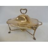 A good quality silver plated entree dish on stand with burner.