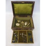A jewellery box containing a small amount of silver jewellery including rings, cross, earrings etc.